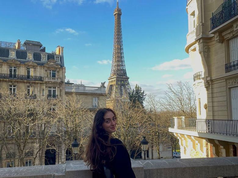 Student in front of Eiffel Tower 